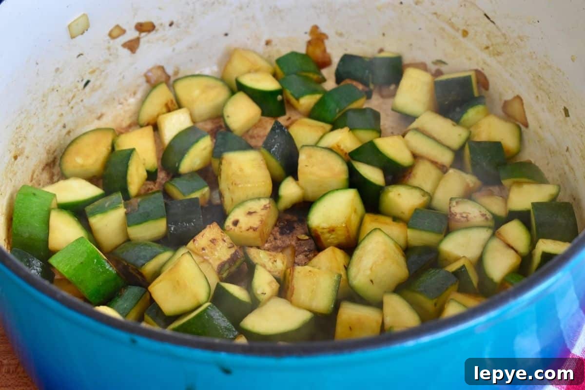 Stovetop Pan-Roasted Vegetables with Garlic White Beans 7 Cooked zucchini in a large pot.