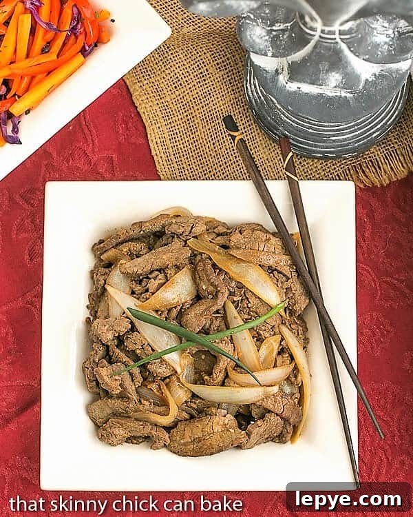 This Beef Bulgogi Recipe is a quick, stir-fried Korean dish that is full of marvelous flavors including garlic and fresh ginger. A little spicy, a little sweet, you will love this easy Asian dinner recipe. Beef Bulgogi on a square white plate with chopsticks