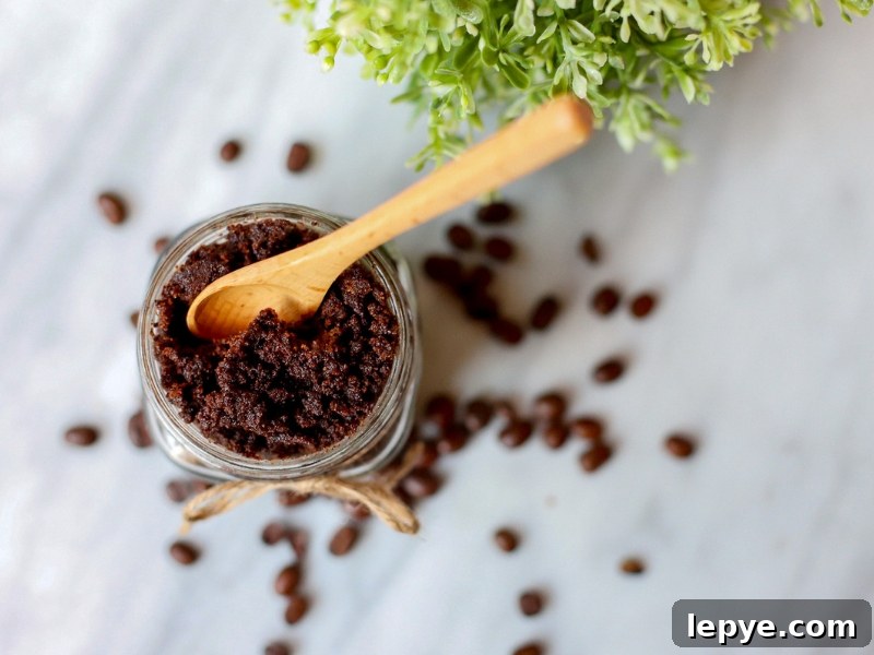 Coffee Sugar Scrub with wooden spoon sticking out.