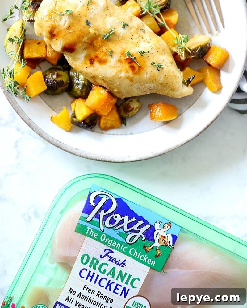 Sheet Pan Chicken with Roasted Butternut Squash 10 A plate of food on a table, with Chicken and Squash