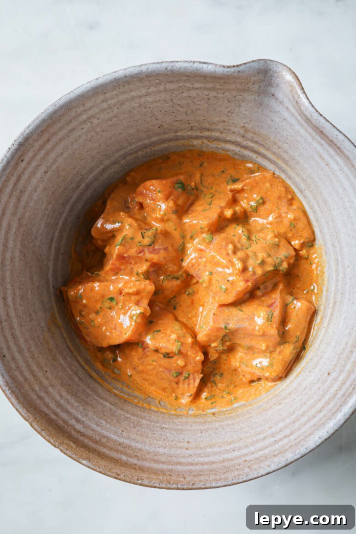 25-Minute Salmon Tikka Recipe: Quick Spiced Fish Tikka 7 A bowl of marinated Salmon.