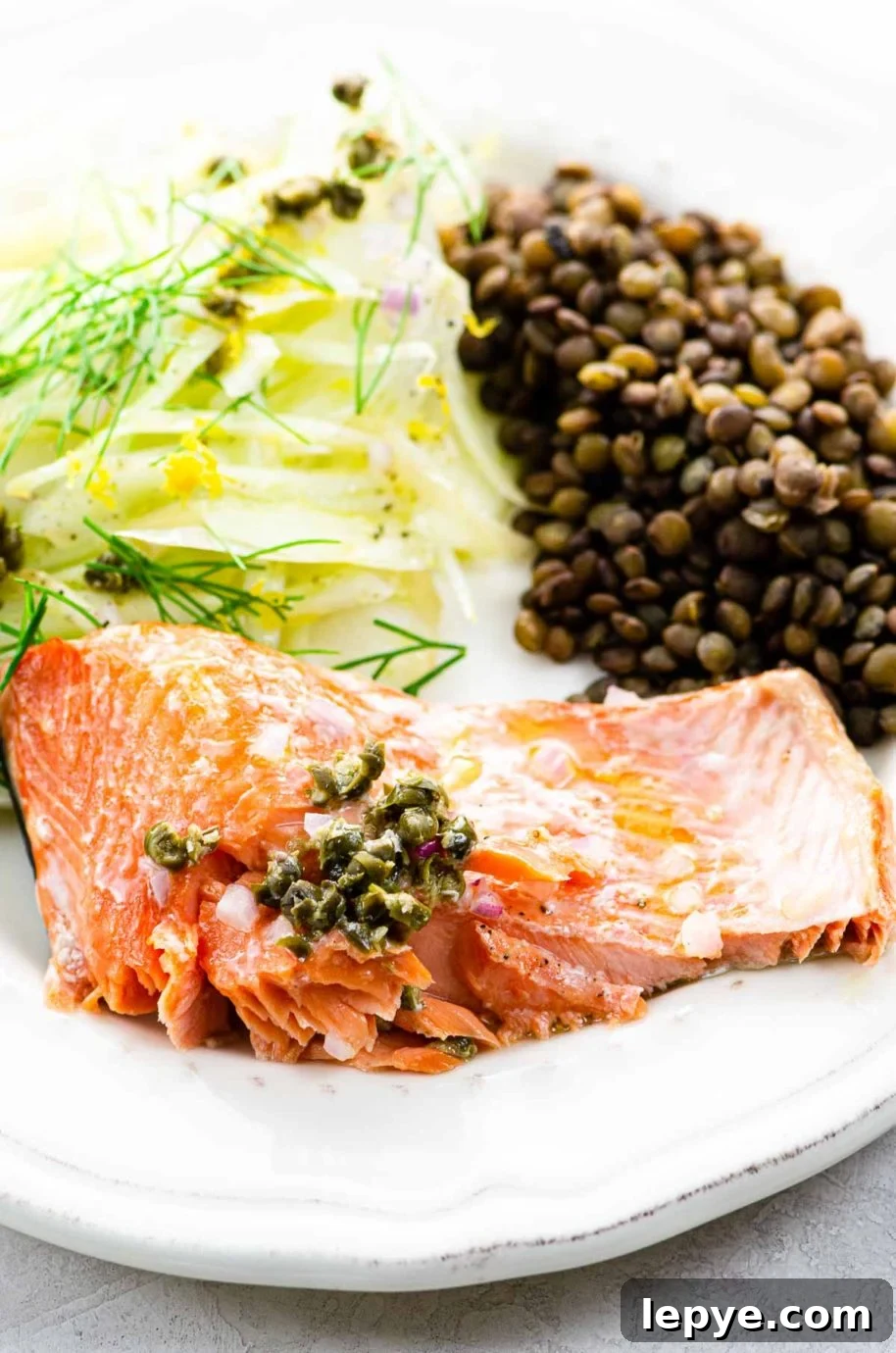 Slow-Roasted Salmon with Shallots, Capers & Lemon Pan Sauce 5 roasted salmon, lentils, and fennel salad on a plate