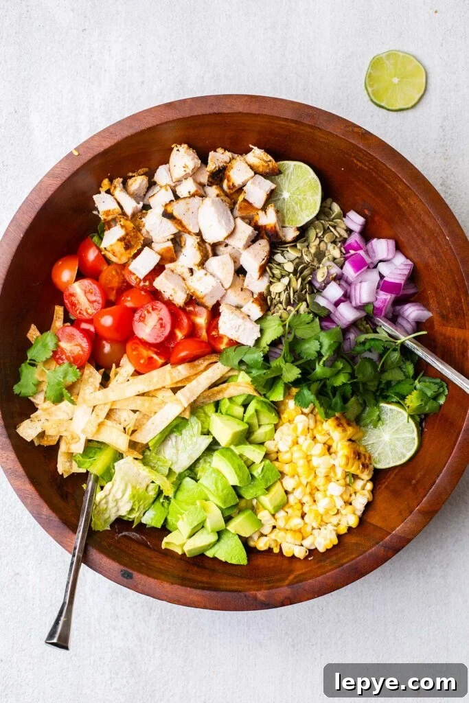 A large salad bowl with the toppings shown added to the lettuce.