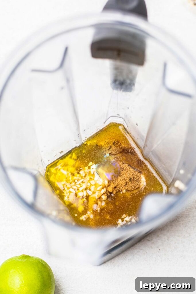 The dressing ingredients shown in a blender.