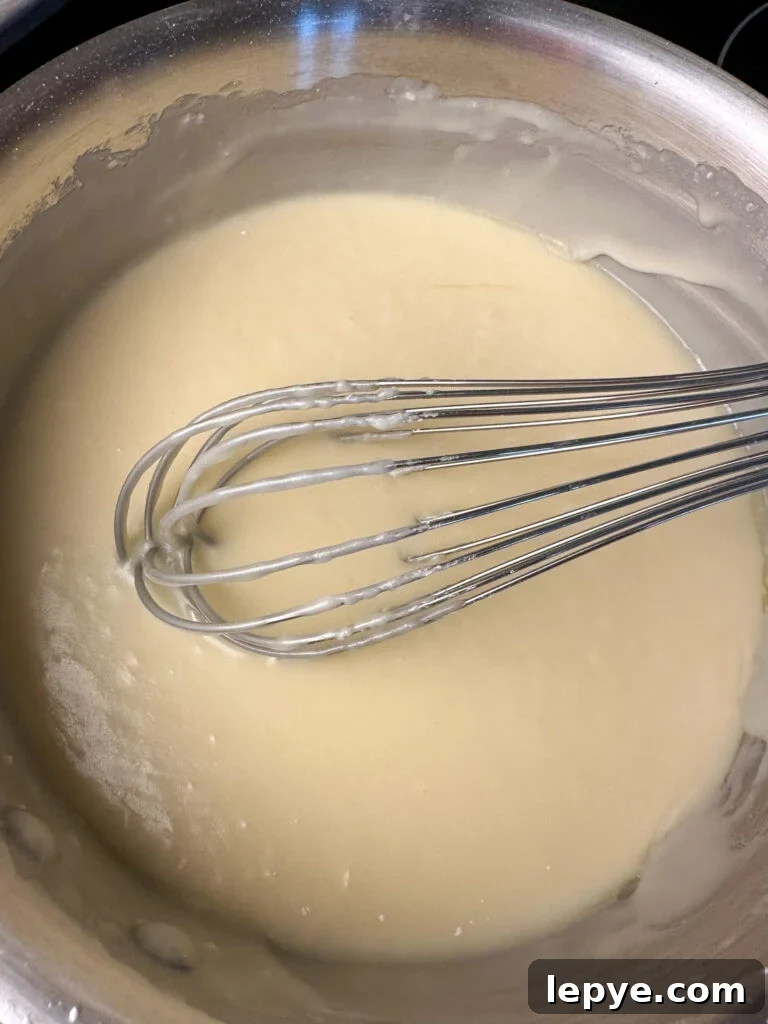 Southern-Style White Texas Sheet Cake Recipe 9 Whisk stirring icing until smooth in a medium sauce pan.