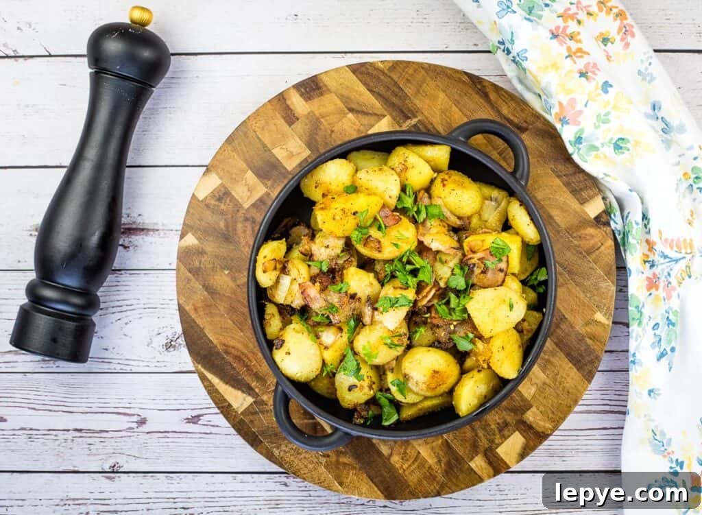 Crispy Blackstone Fried Potatoes: Simple Skillet Recipe 7 blackstone potatoes in a black bowl on a cutting board