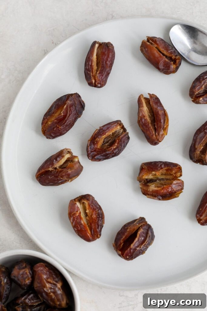 Savory Stuffed Dates: Flavorful Appetizer Recipes for Entertaining 5 dates split in half on plate with pits removed
