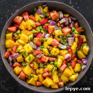 strawberry mango salsa in a large grey bowl