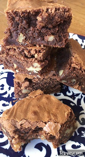 Chewy Walnut Brownies with Gooey Chocolate Center 6 brownies on plate