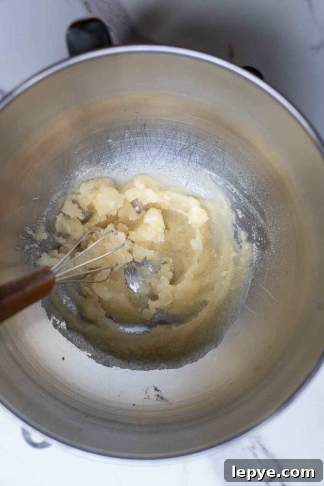 How to Make Homemade Marshmallows from Scratch 3 Gelatin and water mixed together in a stand mixer bowl.