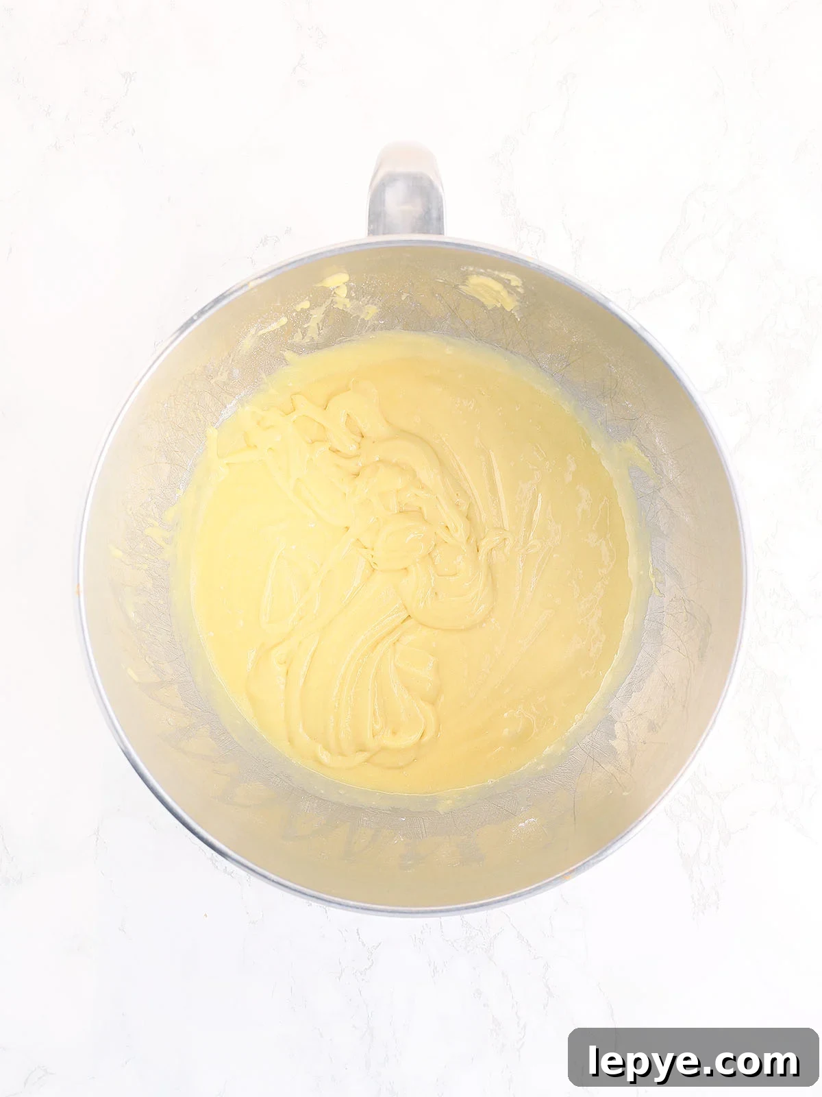 Cake mix, oil and apricot nectar mixed together in a metal bowl