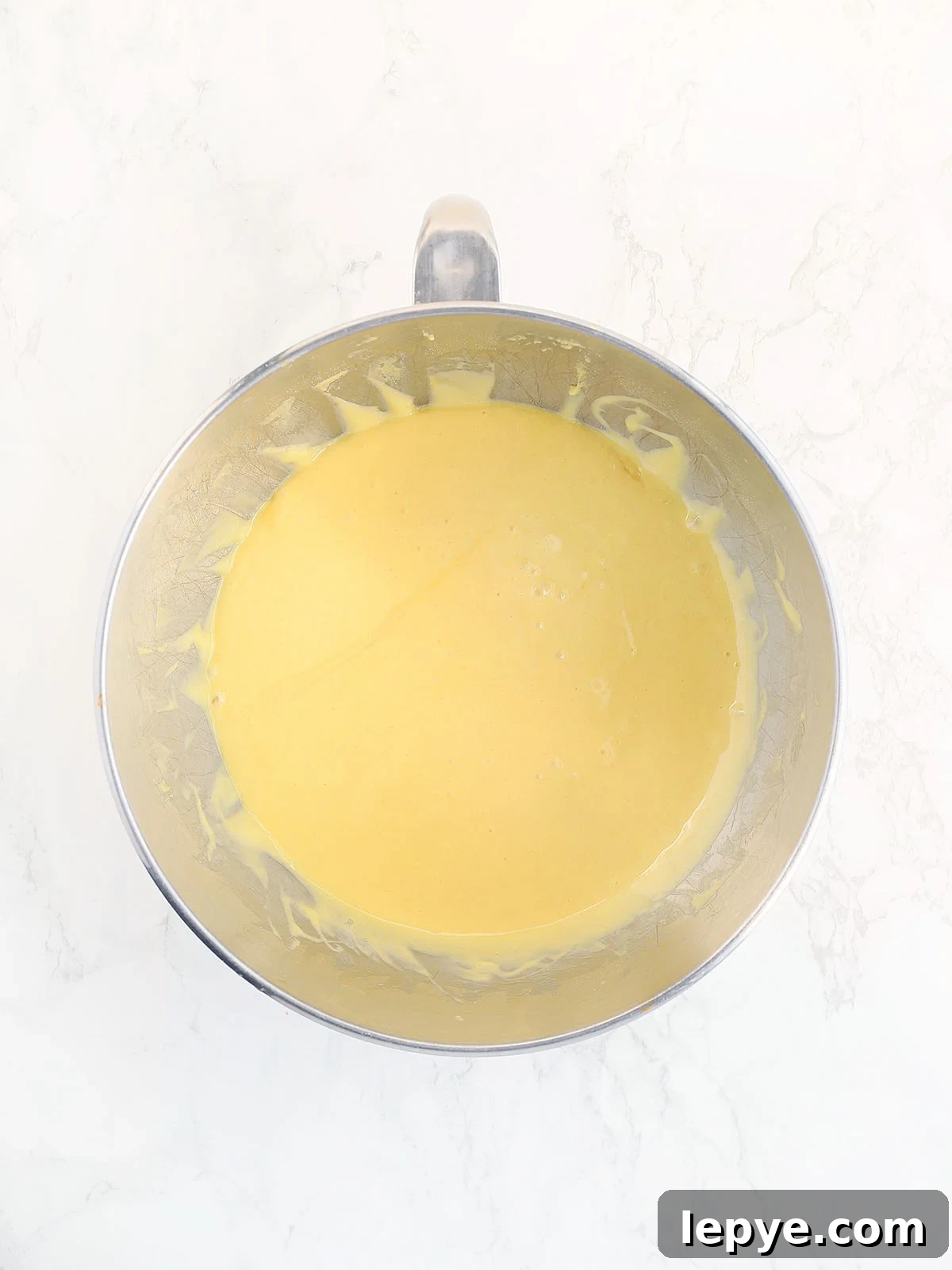 Apricot nectar cake batter after eggs have been added.