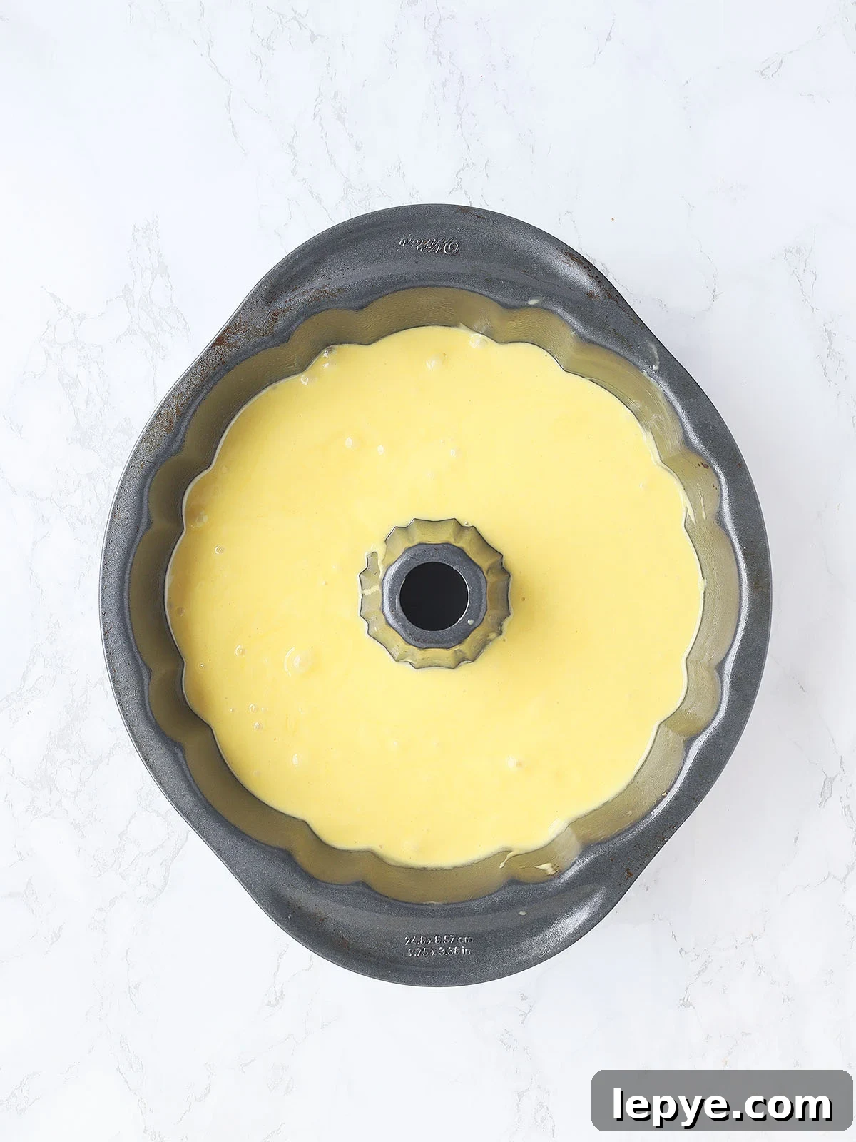Apricot nectar cake batter in a Bundt cake pan.