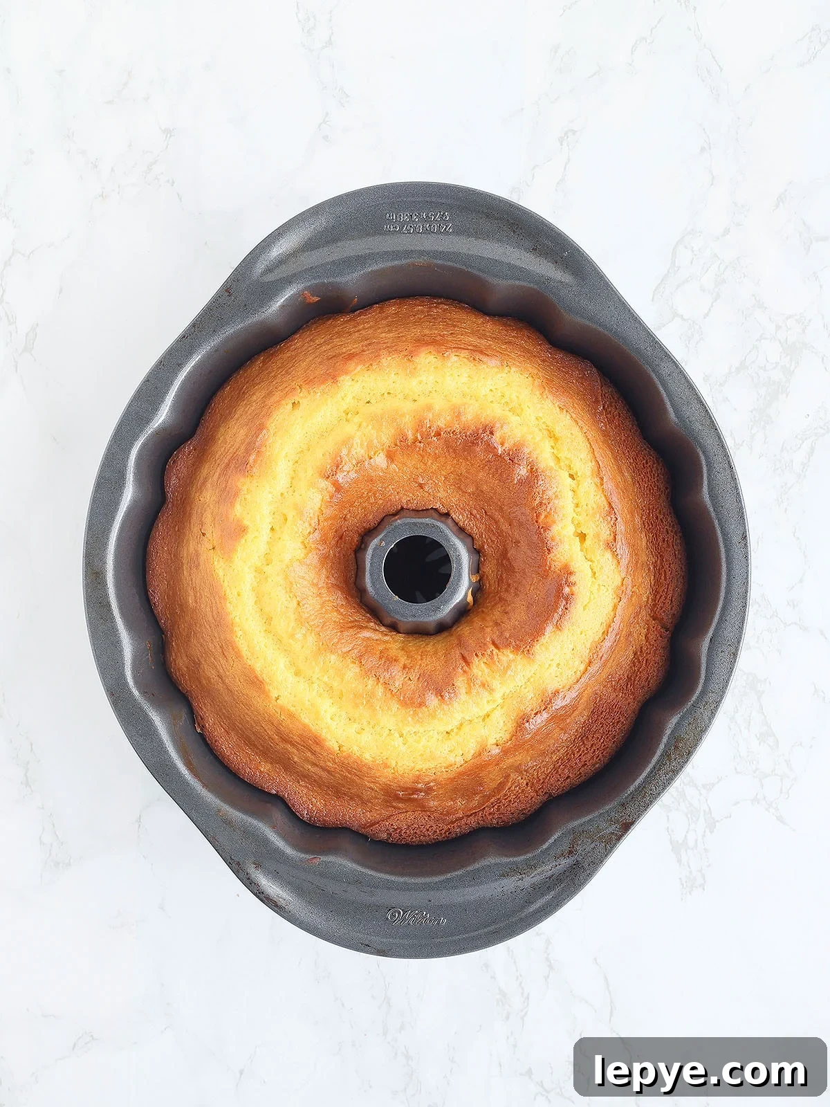 Baked apricot nectar cake cooling in the Bundt pan