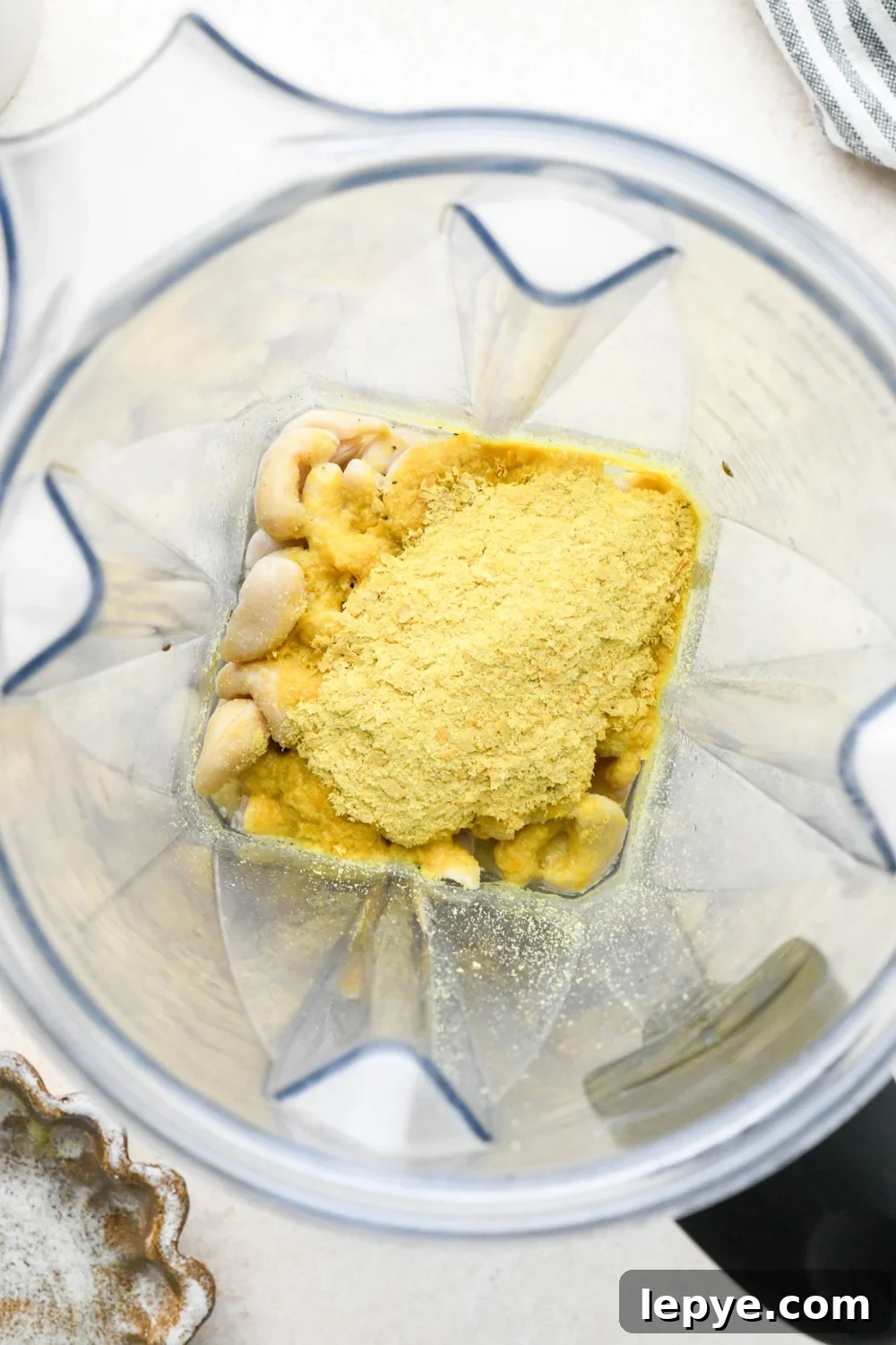 How to make dairy free smoked salmon dip: Ingredients for cashew cream base in a blender container before blending.