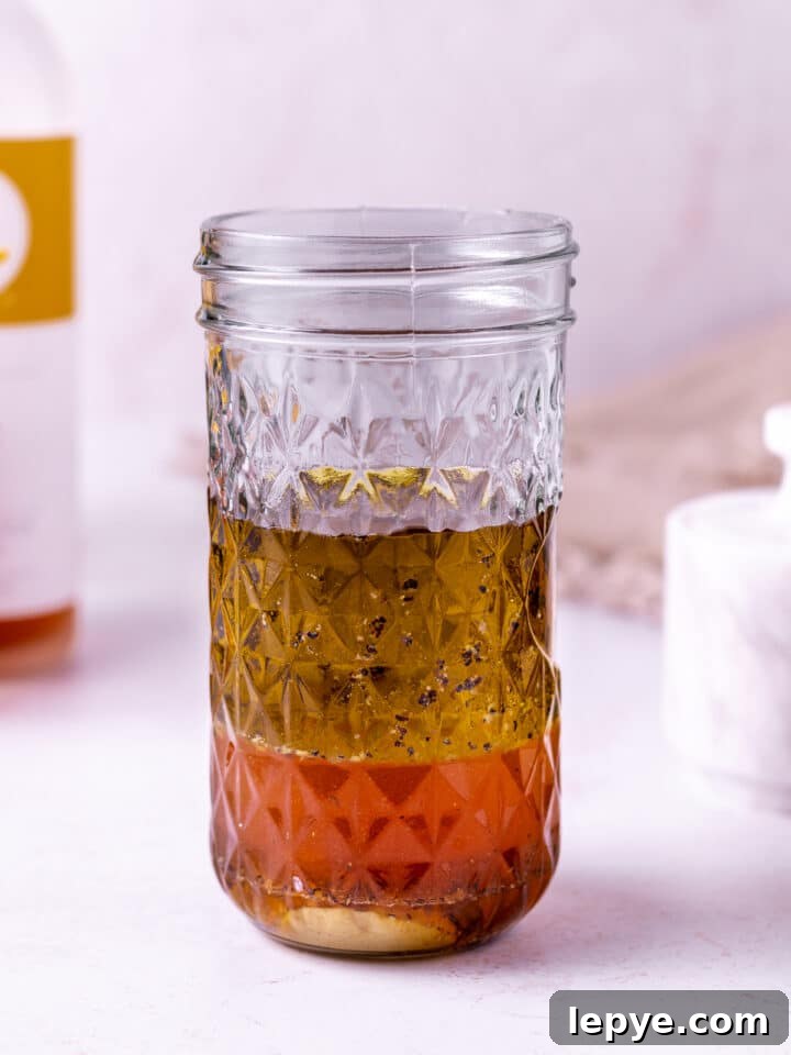 White Balsamic Vinaigrette Recipe: Tangy Salad Dressing with Herbs 7 mason jar with unmixed salad dressing ingredients