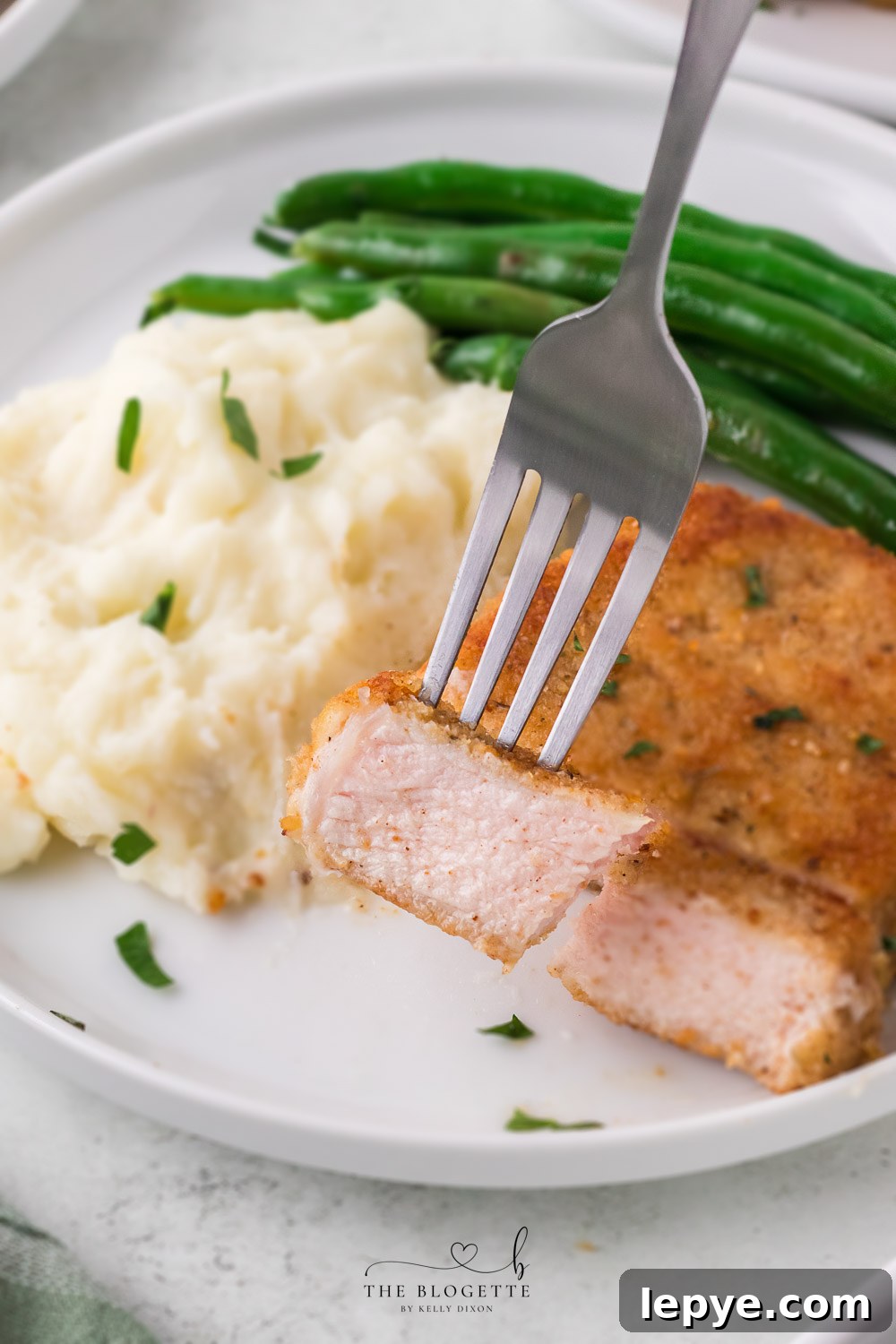 Breaded Fried Pork Chops cooked to crispy perfection! Golden brown boneless pork chops are crispy on the outside and juicy on the inside.