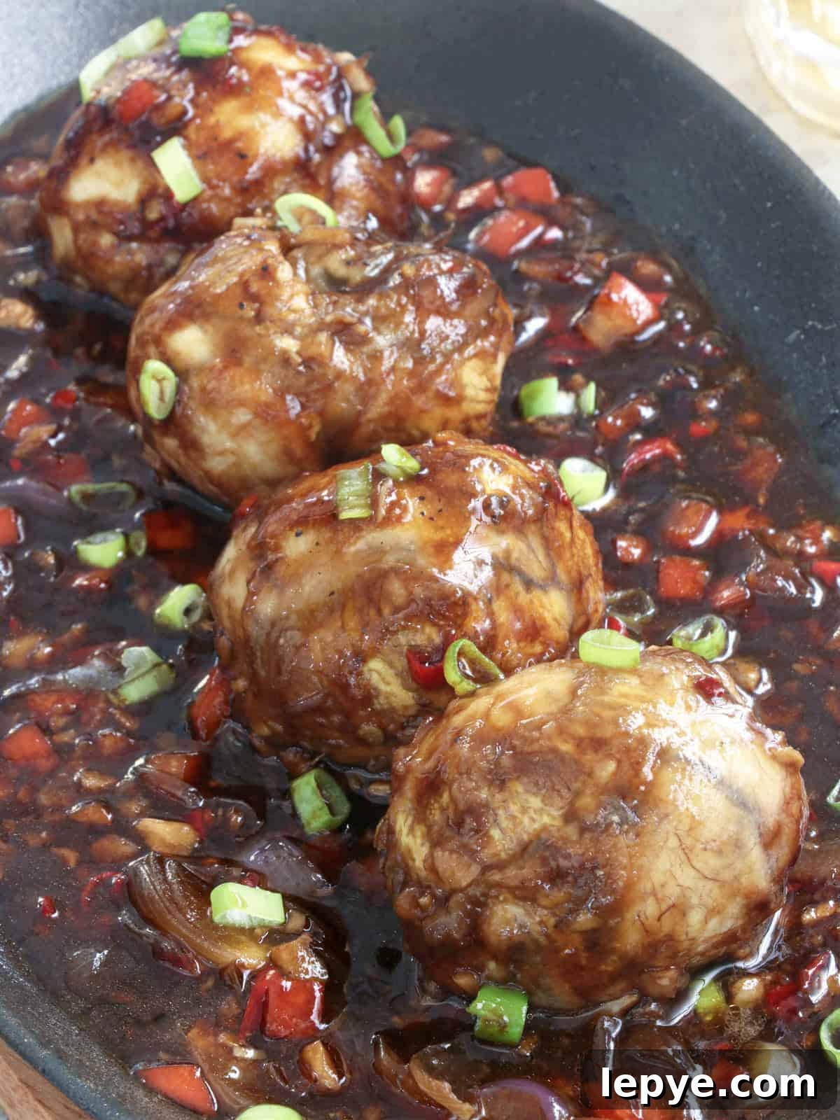 Sizzling Balut: How to Cook Crispy Filipino Balut Skillet 2 balut with a spicy sauce in a cast iron skillet