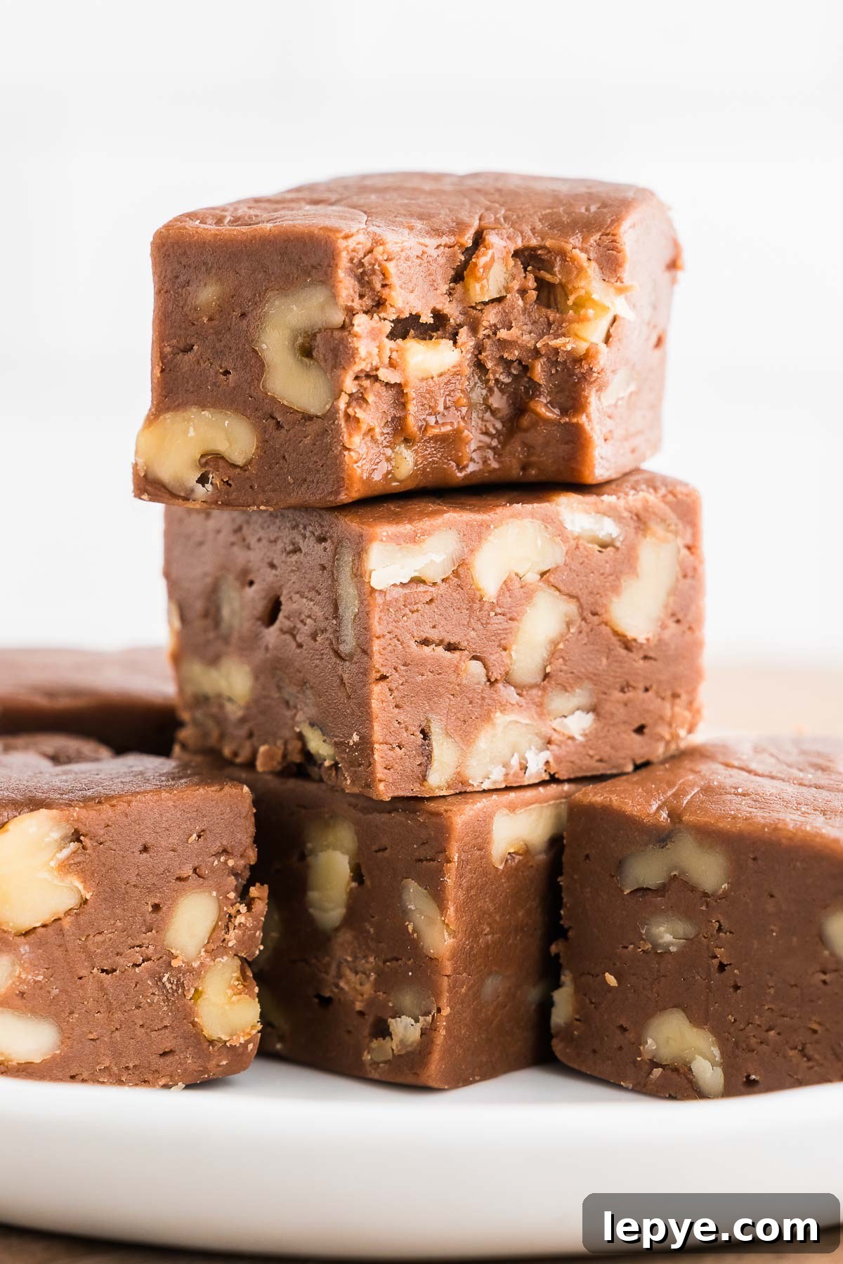 Velveeta Fudge Recipe: Creamy Sweet Cheesecake-Style Fudge 4 fudge stacked on a plate
