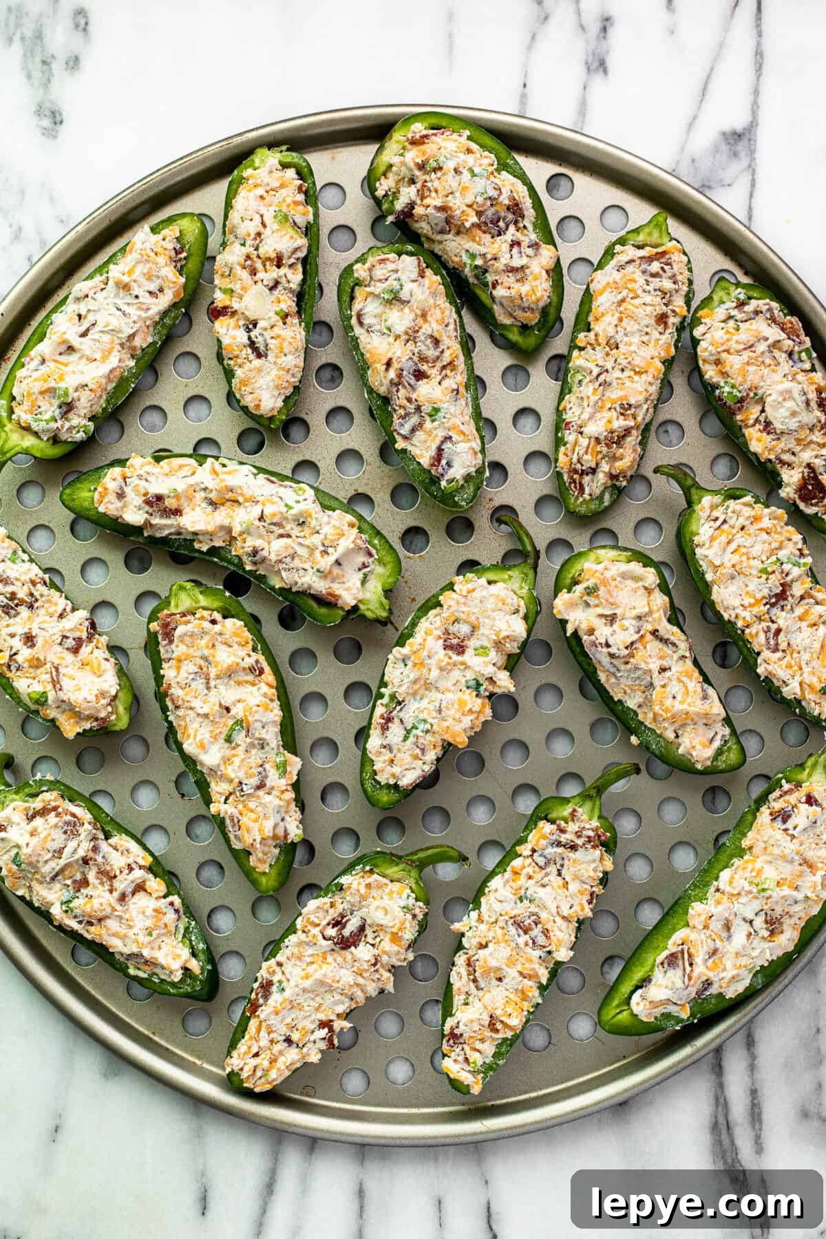 Smoked Jalapeño Poppers Recipe for Perfect Grill Parties 8 Large pizza pan with freshly made jalapeno poppers ready for the smoker.