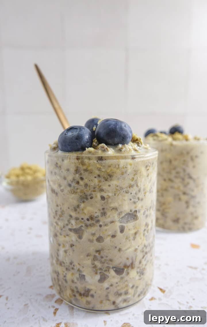 brown sugar overnight oats in a glass jar topped with blueberries