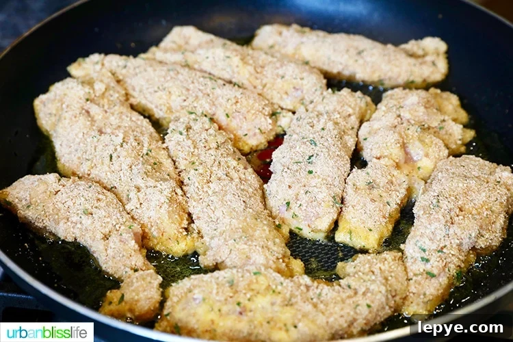 Crispy Breaded Chicken Tenders Recipe for Perfectly Crunchy Results 11 landscape pic of frying chicken tenders