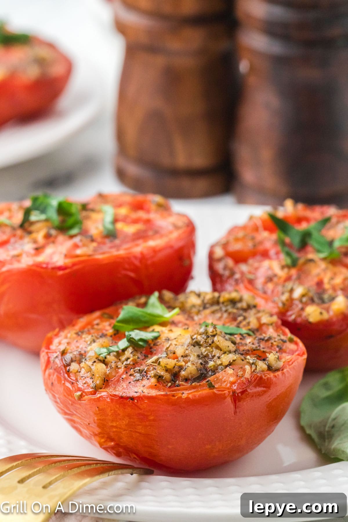 Smoked Tomato Recipe: How to Smoke Tomatoes for Rich Flavor 11 Slice tomatoes and spices and fresh basil on a platter
