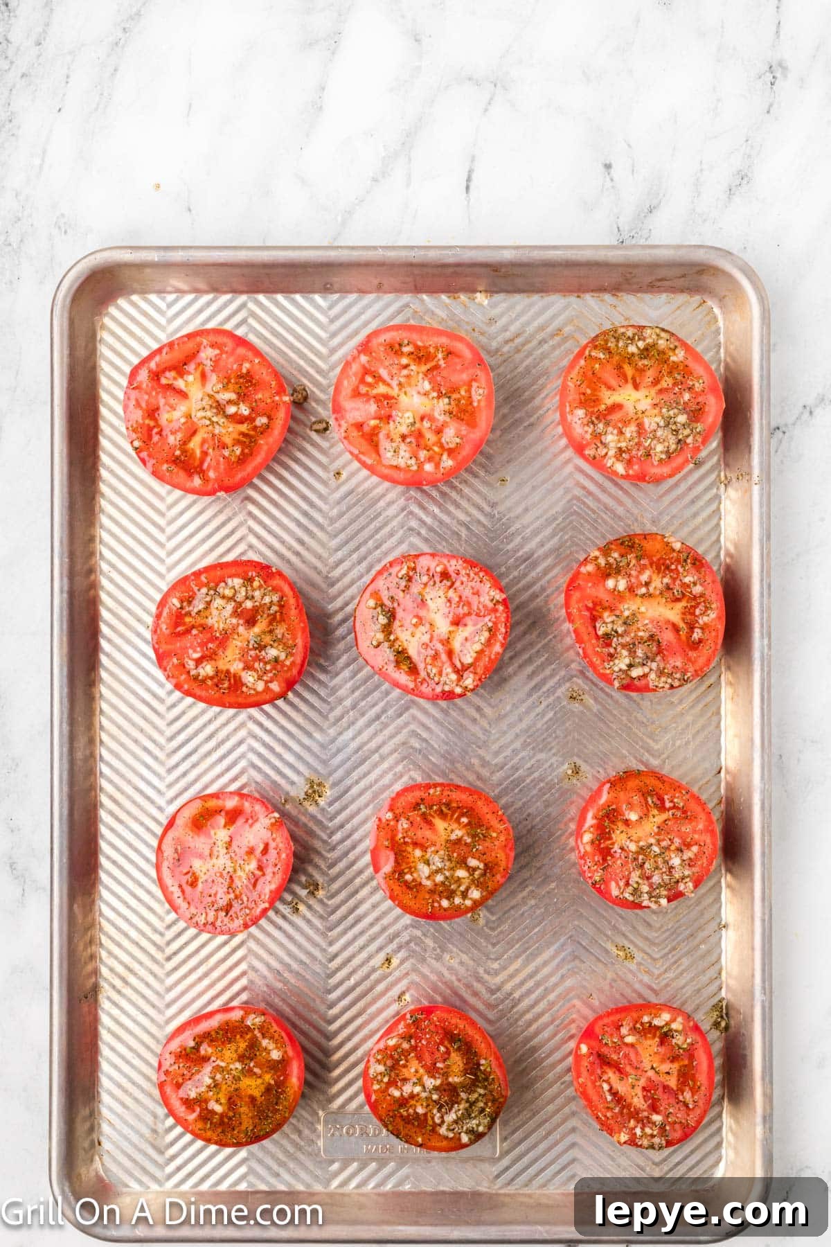 Smoked Tomato Recipe: How to Smoke Tomatoes for Rich Flavor 6 Drizzling oil and spices on a baking sheet