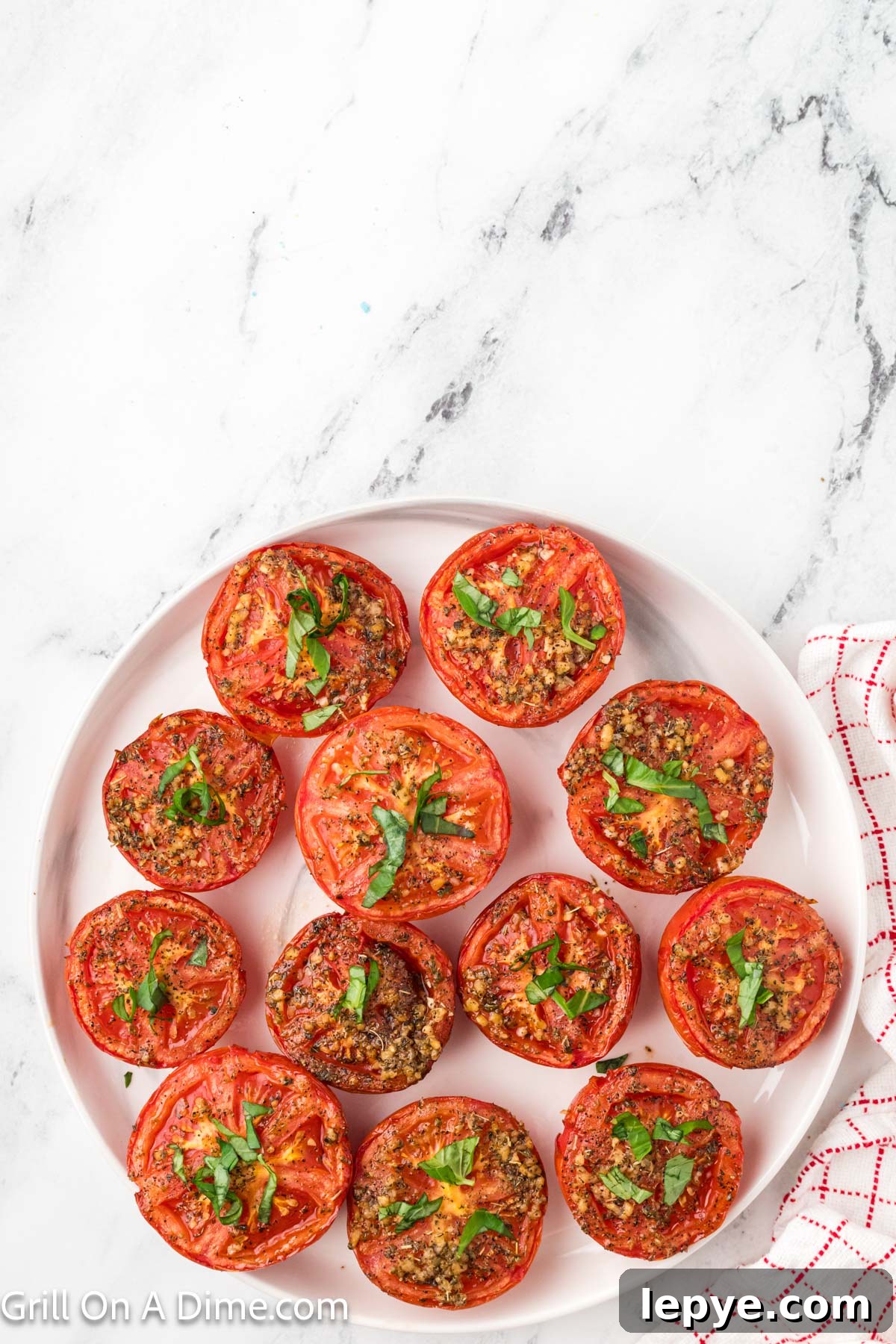Smoked Tomato Recipe: How to Smoke Tomatoes for Rich Flavor 9 Smoked tomatoes slices on a white platter
