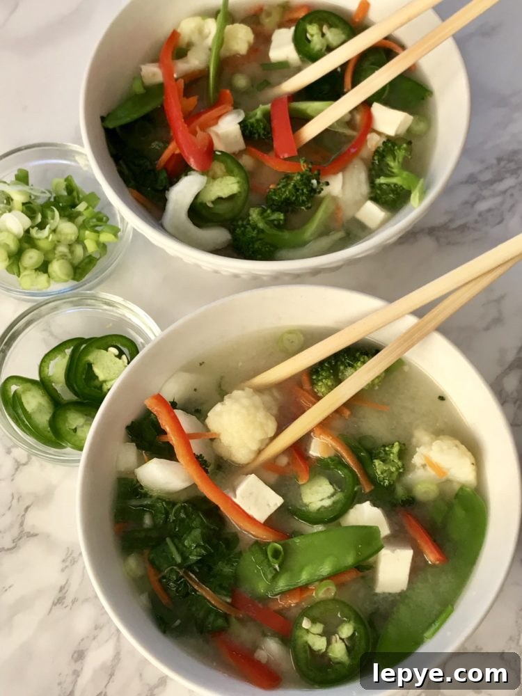 Miso soup with tofu and chunky vegetables. 