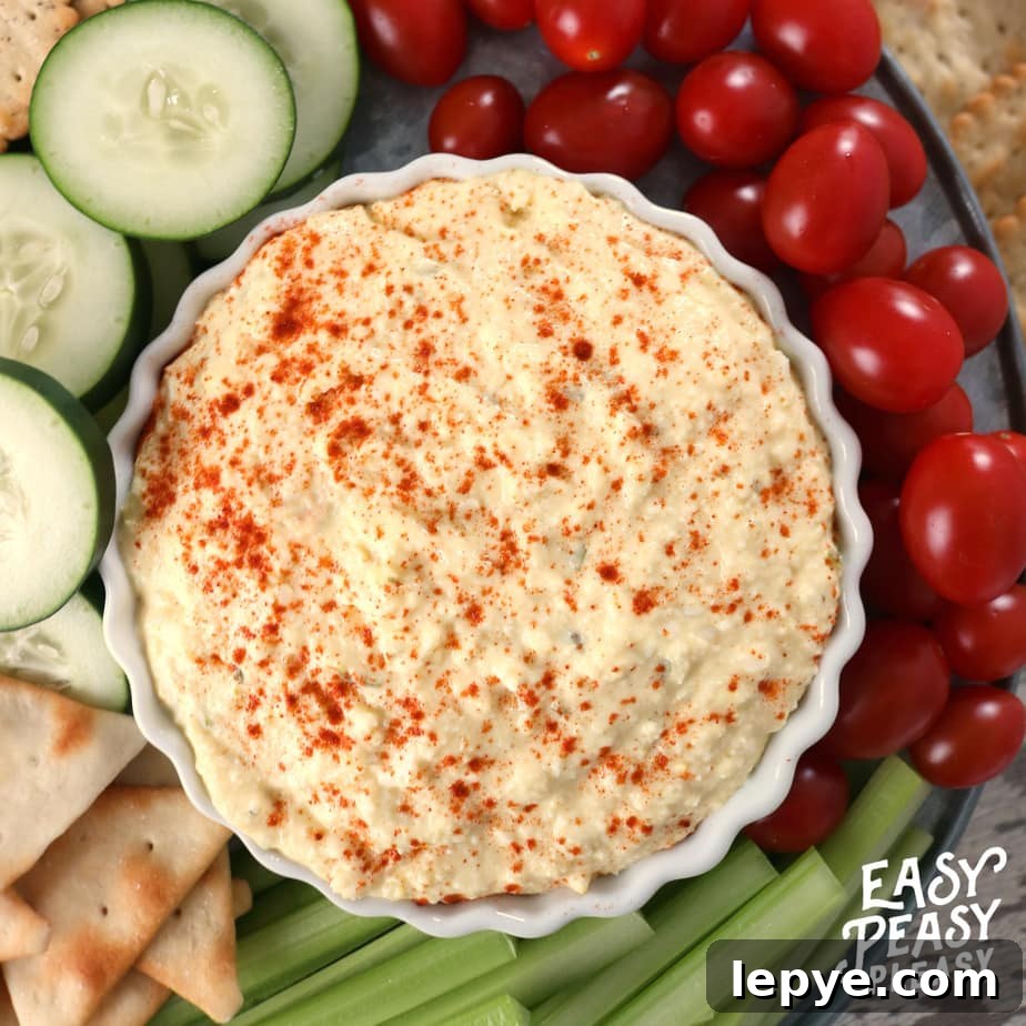 The perfect dip for holidays or any occasion. Classic Deviled Egg Dip will be a hit. #deviledegg #deviledeggs #deviledeggdip