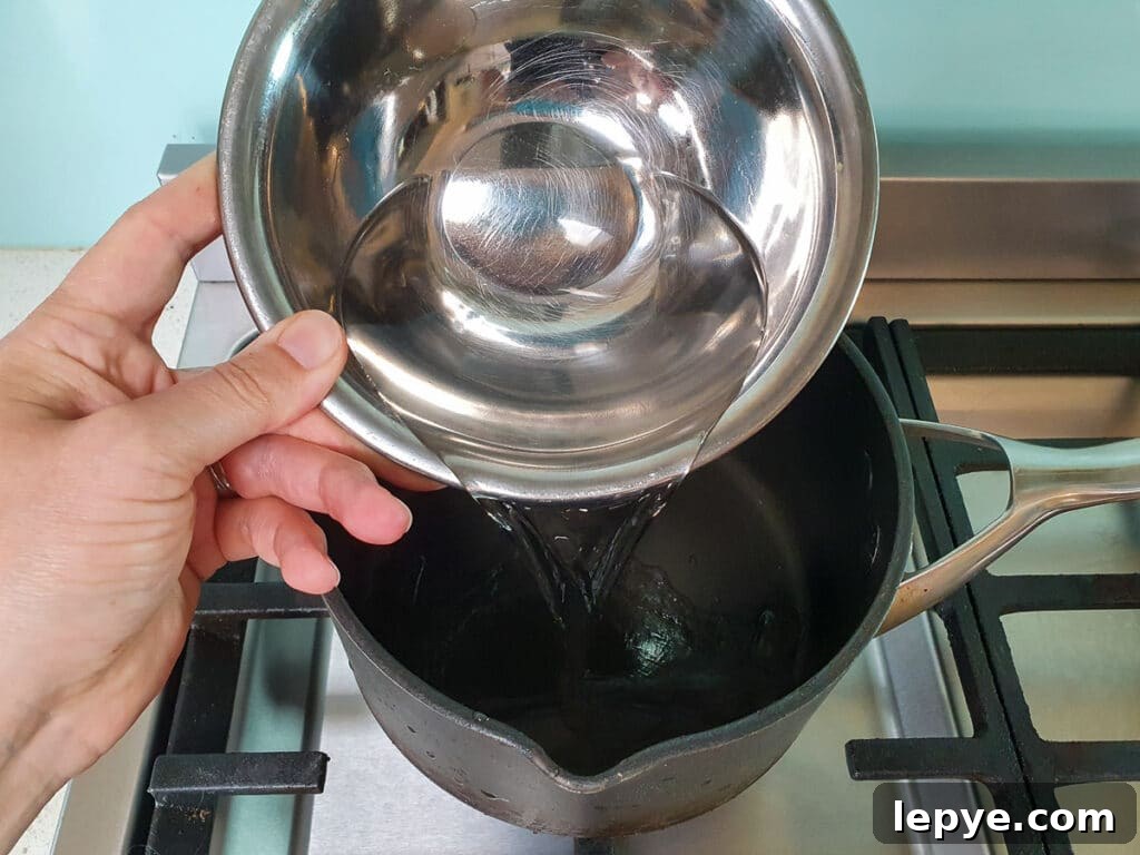 Refreshing Lime Popsicle Recipe: Homemade Citrus Ice Pops 5 Adding water to pot.