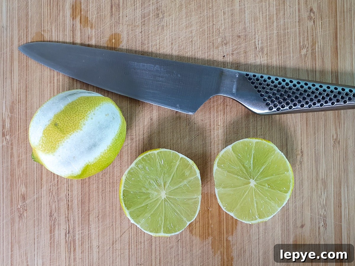 Refreshing Lime Popsicle Recipe: Homemade Citrus Ice Pops 8 Slicing limes to juice.