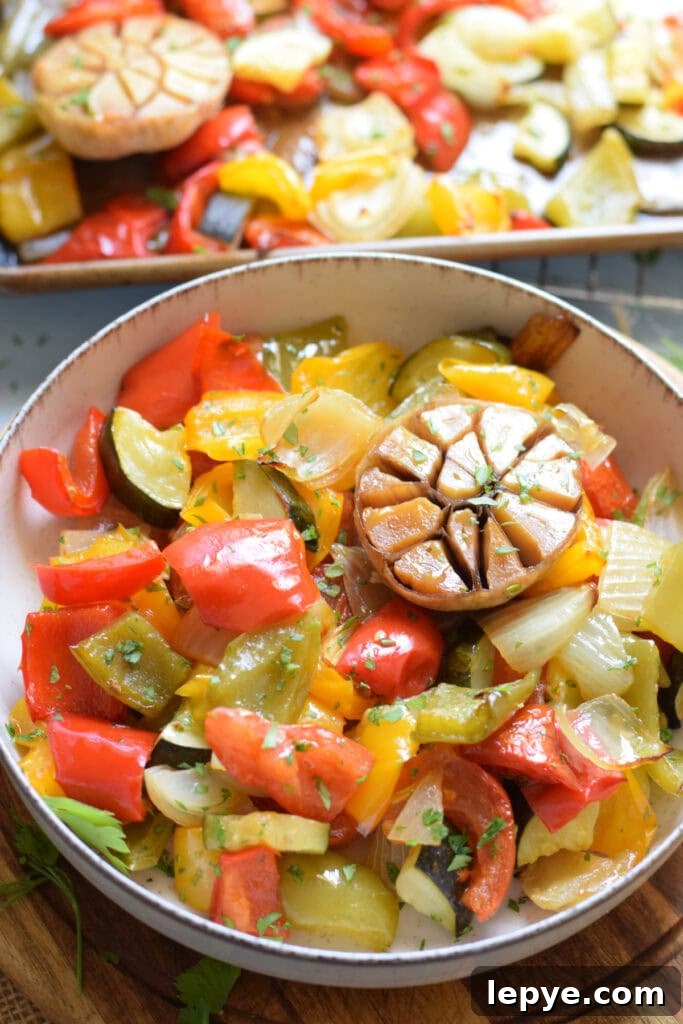 Mediterranean Sheet Pan Roasted Vegetables for Weeknight Meals 11 Roasted vegetables in a bowl.