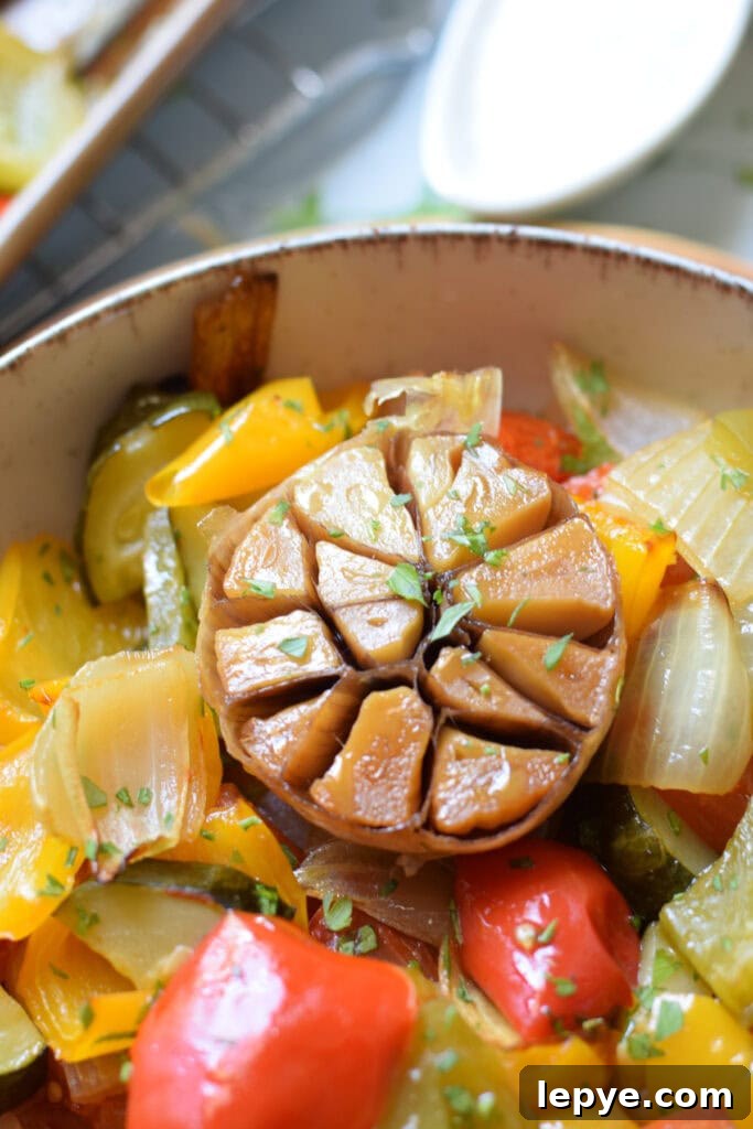Mediterranean Sheet Pan Roasted Vegetables for Weeknight Meals 12 Close up of roasted garlic.