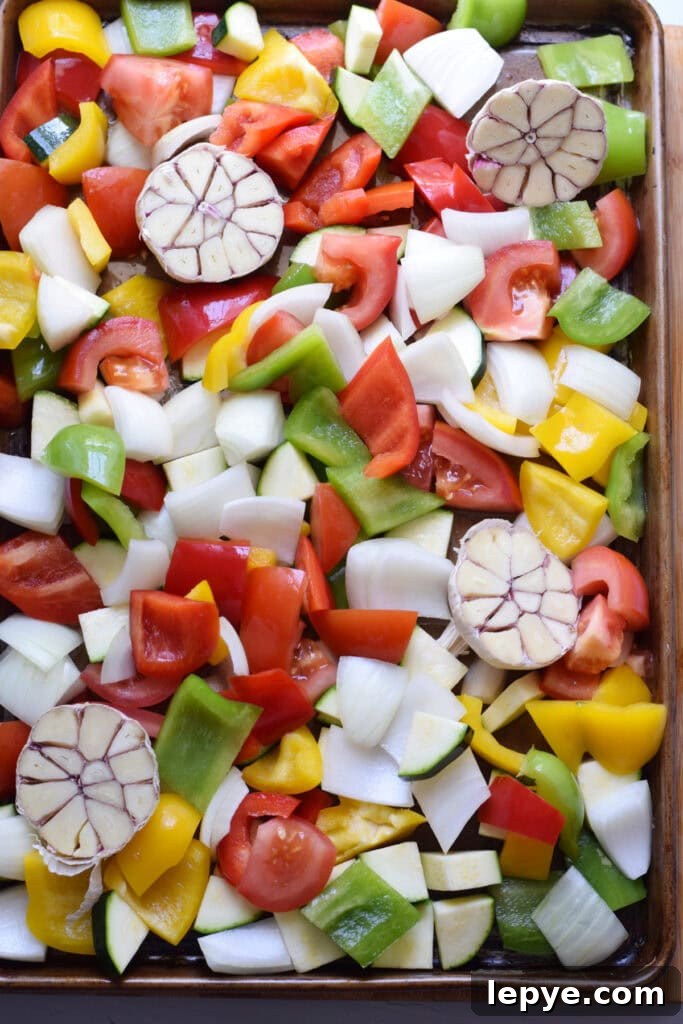 Mediterranean Sheet Pan Roasted Vegetables for Weeknight Meals 8 Vegetables on a baking tray.