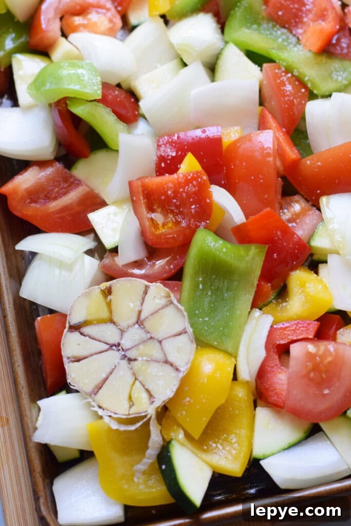 Mediterranean Sheet Pan Roasted Vegetables for Weeknight Meals 9 Close up of vegetables on a baking tray.