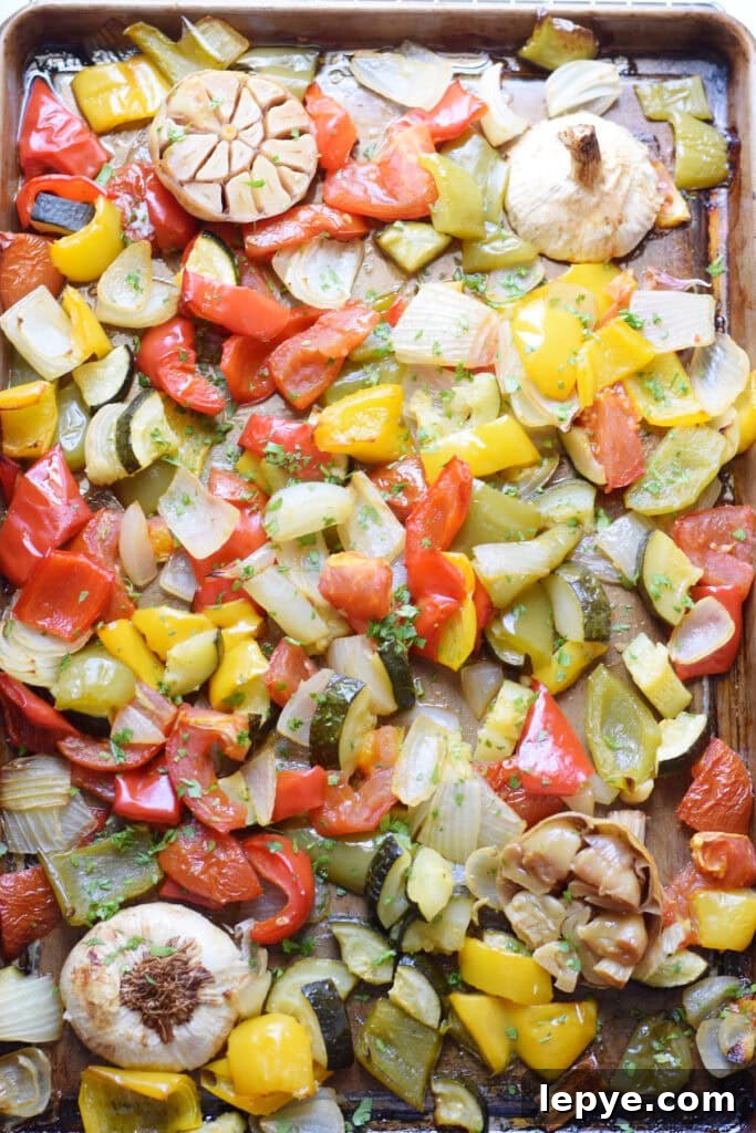 Mediterranean Sheet Pan Roasted Vegetables for Weeknight Meals 10 Roasted vegetables on a baking tray.