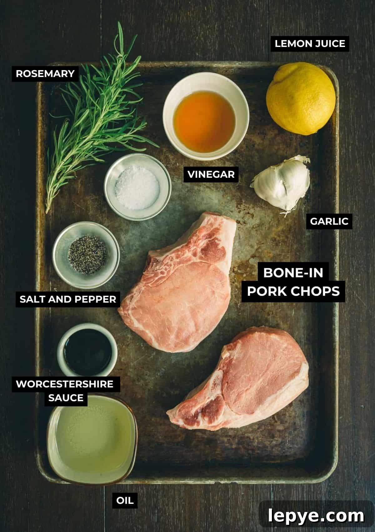 Garlic Herb Pork Chop Marinade for Juicy, Flavorful Chops 3 Ingredients for grilled pork chops with marinade on a table.
