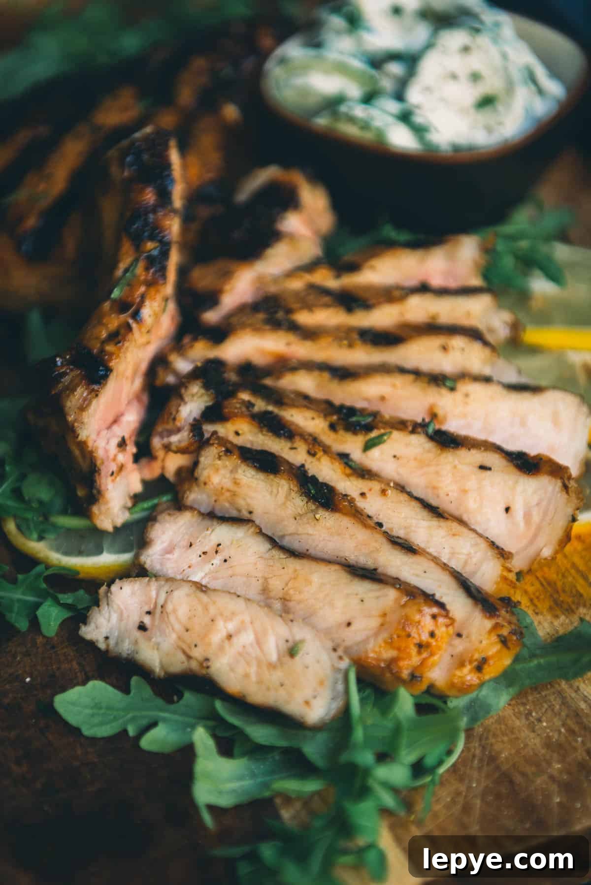 Garlic Herb Pork Chop Marinade for Juicy, Flavorful Chops 7 A juicy sliced grilled pork chop.