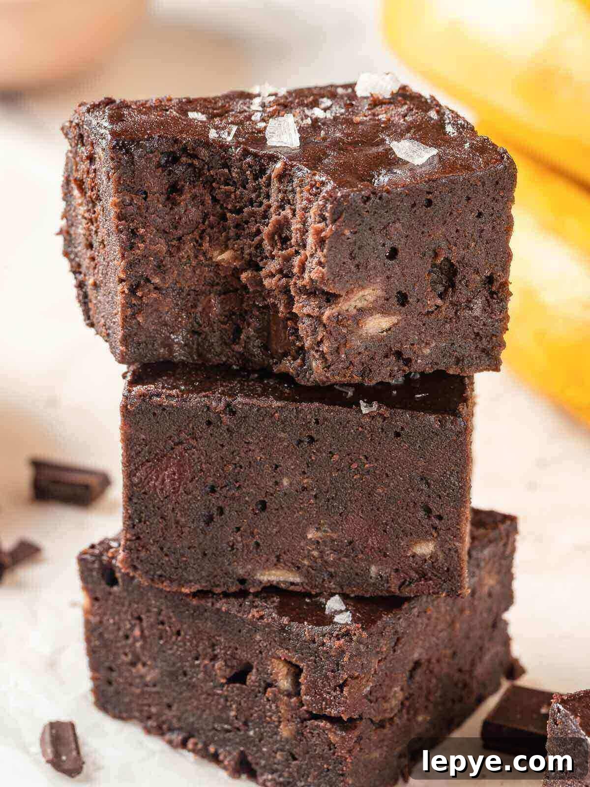 Fudgy Banana Brownies Made with Ripe Bananas 2 A stack of three banana brownies.