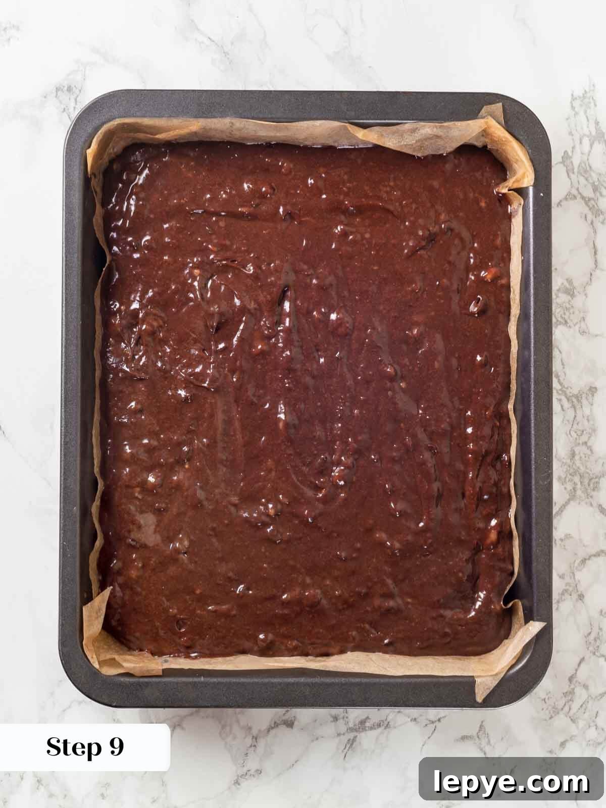 Fudgy Banana Brownies Made with Ripe Bananas 11 Unbaked banana brownie batter in a pan.