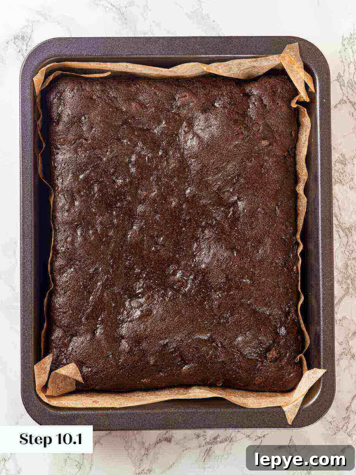 Fudgy Banana Brownies Made with Ripe Bananas 12 Baked banana brownies in a pan.