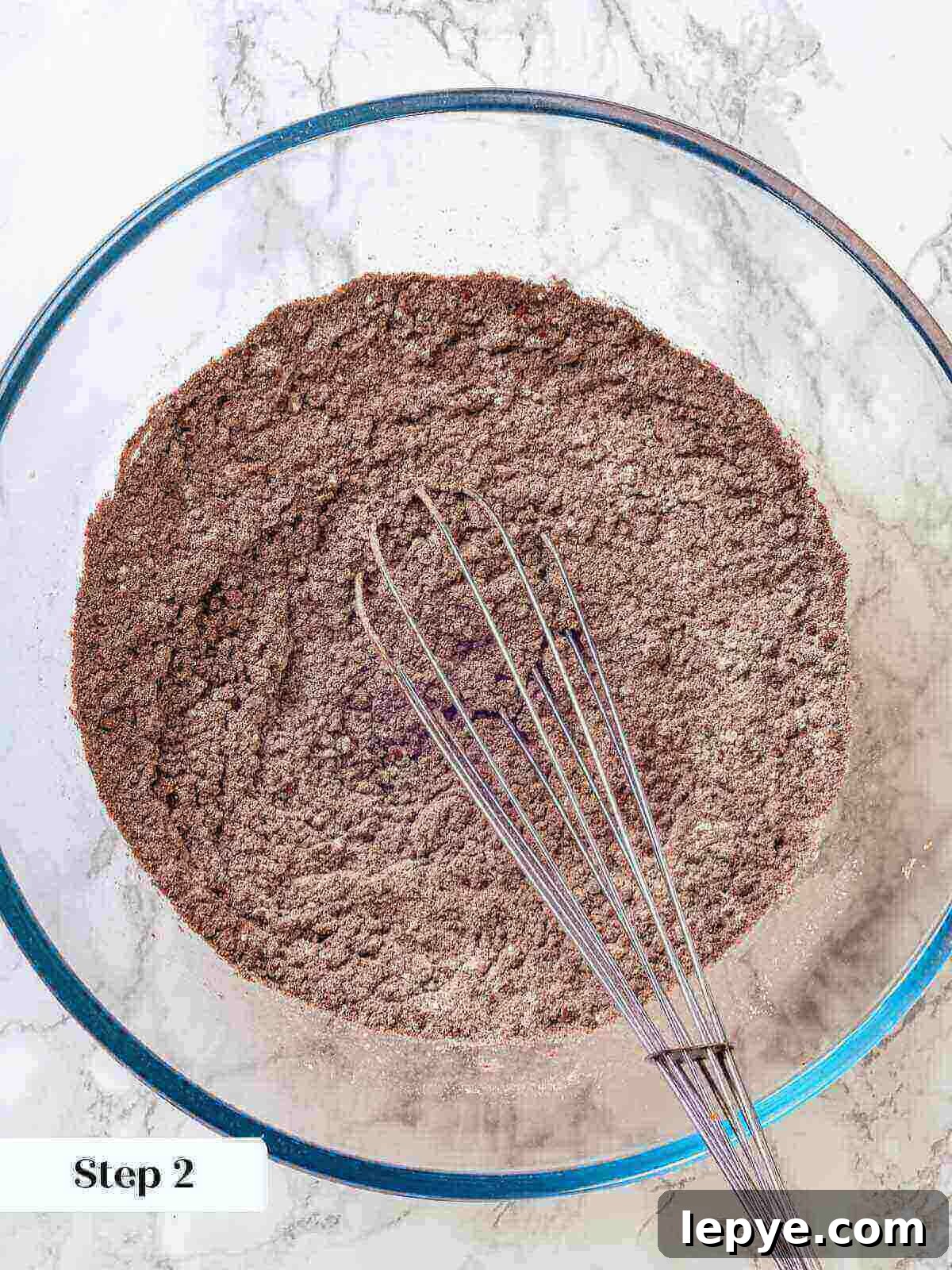 Fudgy Banana Brownies Made with Ripe Bananas 6 Whisking dry ingredients for banana brownies.