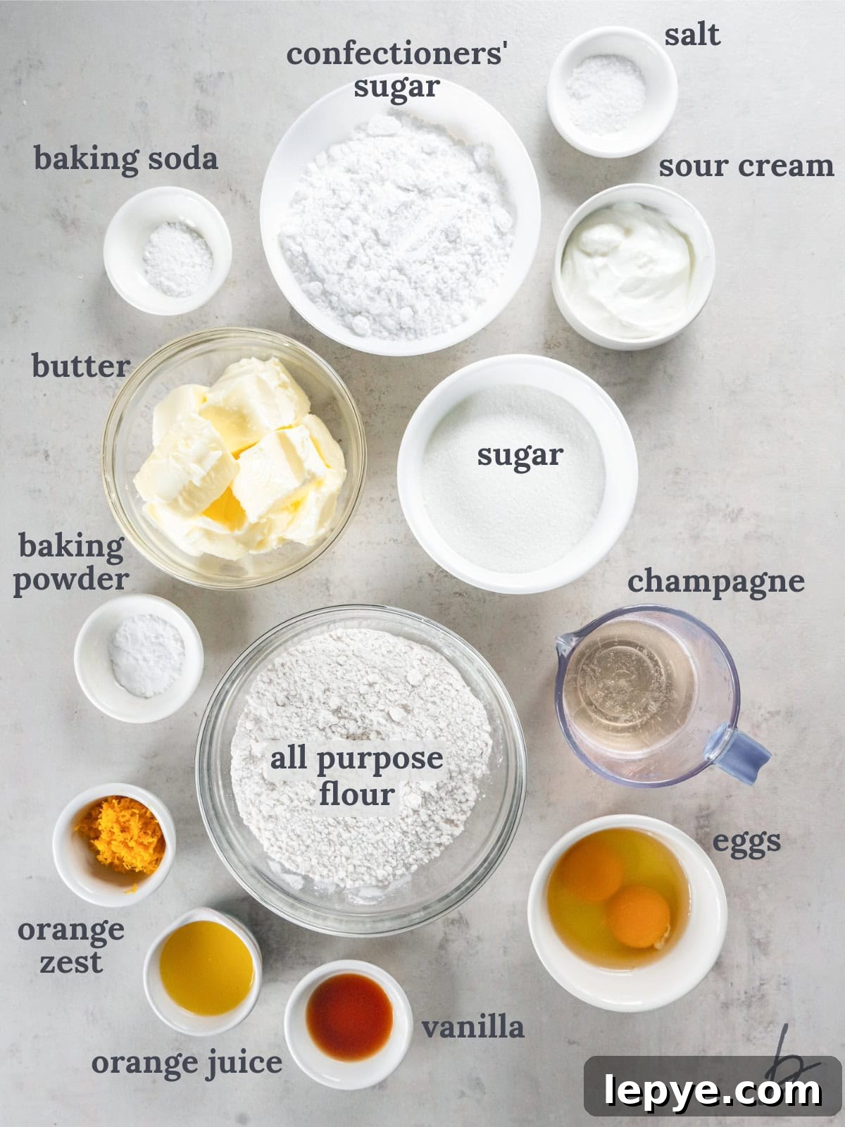 bowls of ingredients to make mimosa cupcakes with champagne frosting.