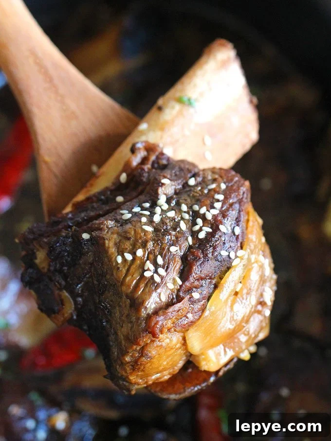 Slow Cooker Asian Short Ribs topped with sesame seeds