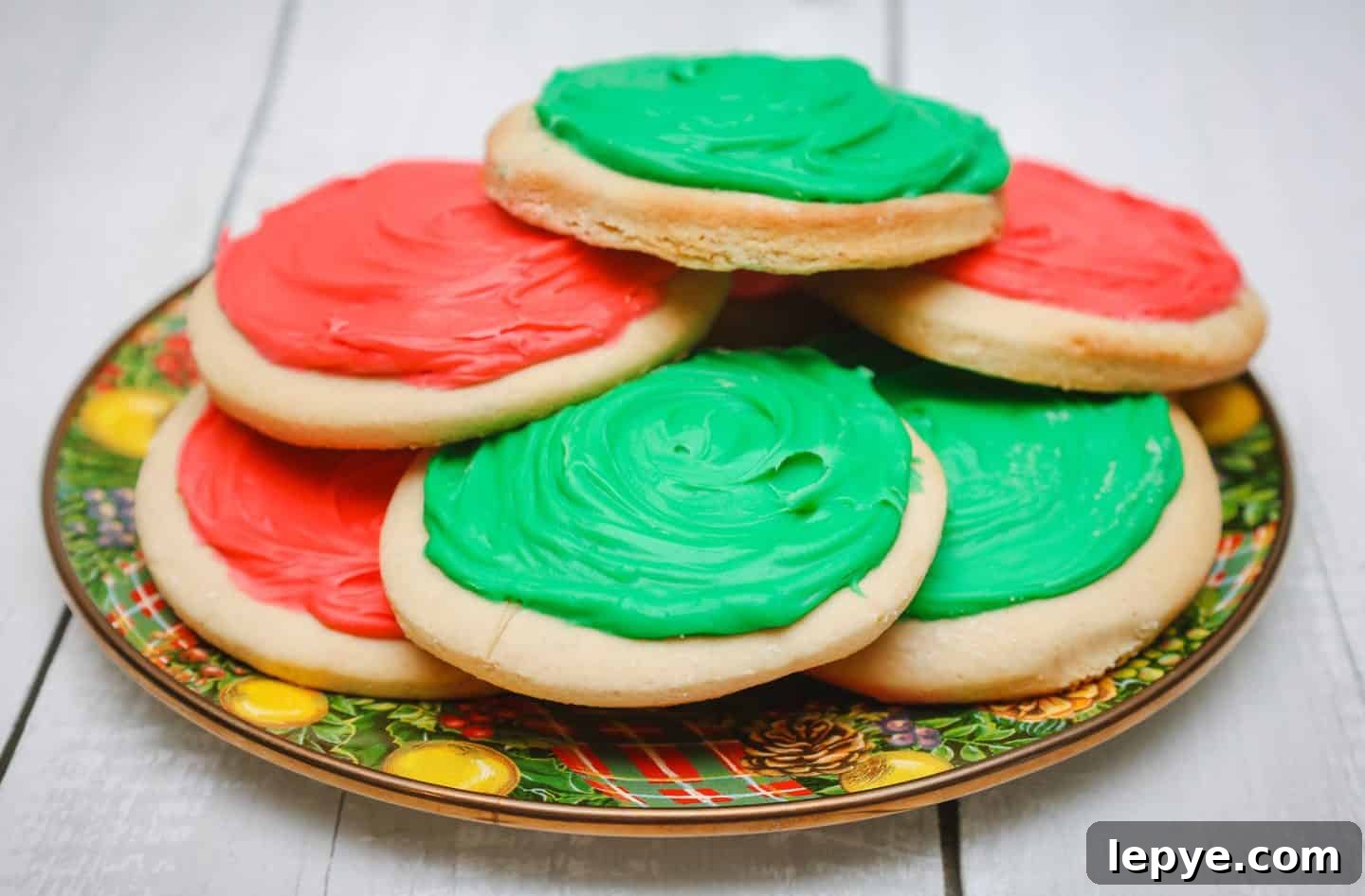 Southern Soul Tea Cake with Sweet Icing - Classic Recipe 2 Southern Soul Food Traditional Tea Cakes With Icing - A festive plate of Southern soul food tea cakes with red and green icing, stacked and ready for Christmas celebrations. A Black folks’ holiday dessert tradition, homemade and full of legacy 'flava.' Recipe by Shaunda Necole & The Soul Food Pot®.