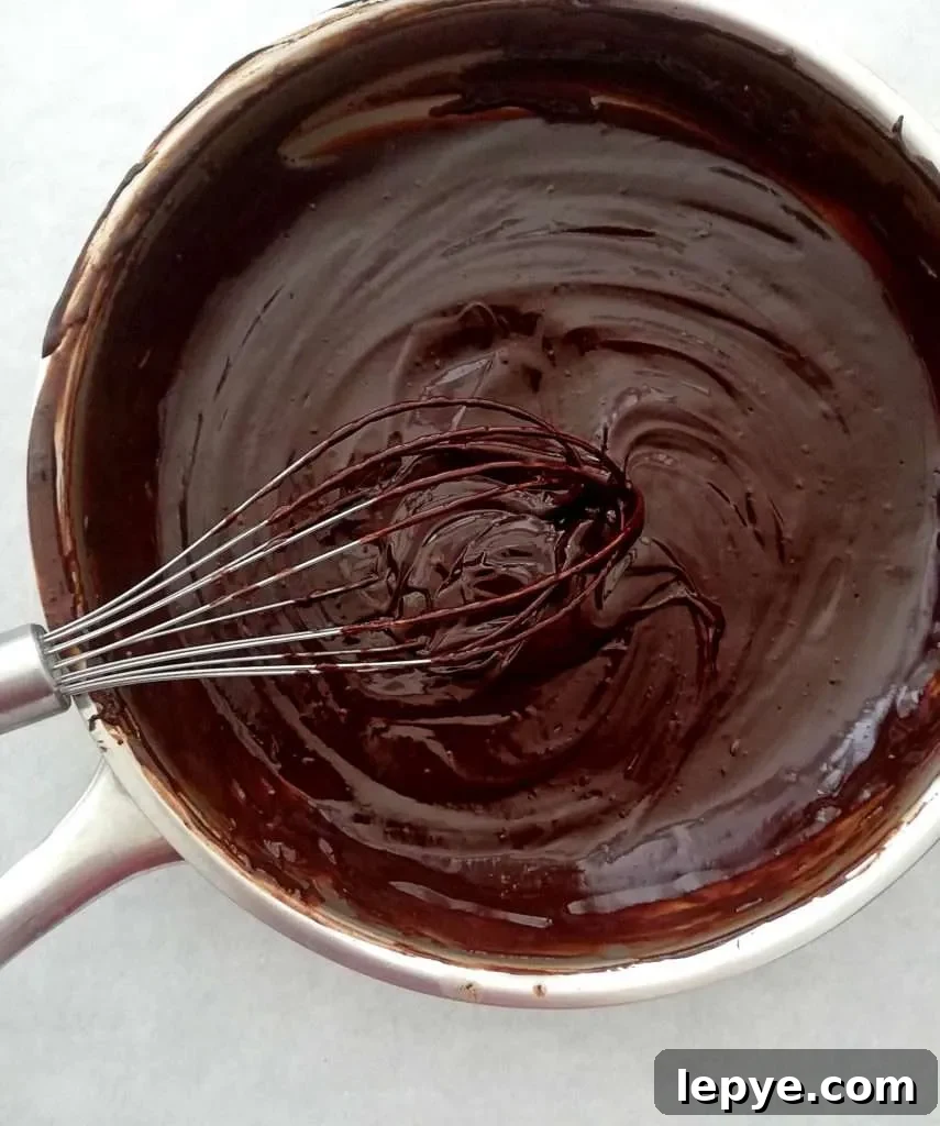 Vanilla No-Bake Biscuit Cake Recipe — Quick, Creamy Dessert 9 chocolate layer melted