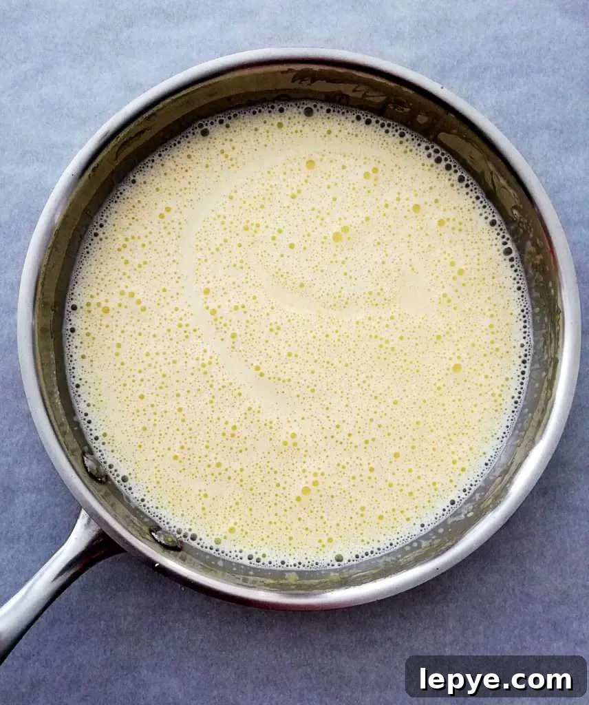 Vanilla No-Bake Biscuit Cake Recipe — Quick, Creamy Dessert 6 no bake biscuit cake pudding prep - milk added