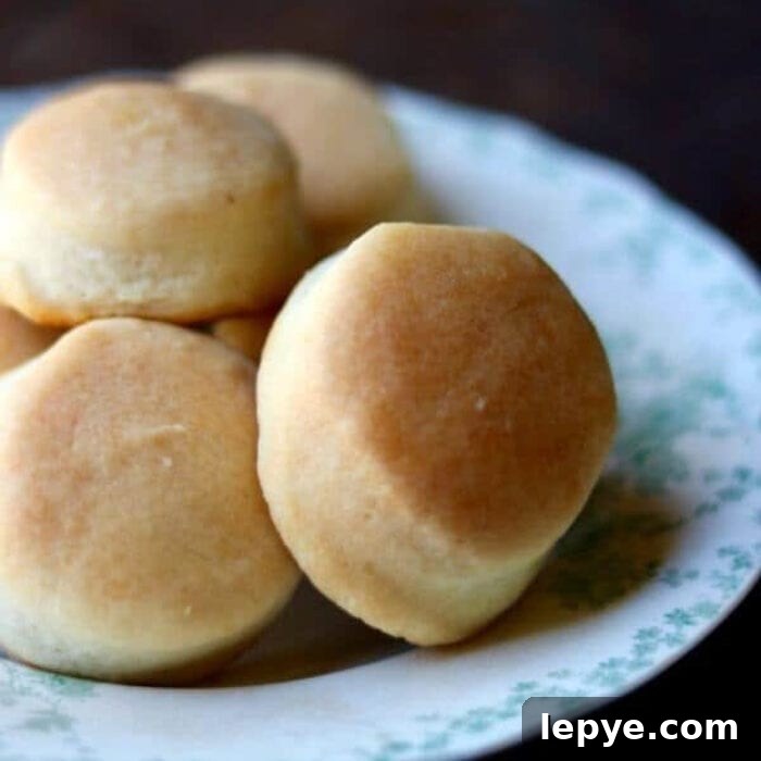Close up of biscuits piled on a plate.